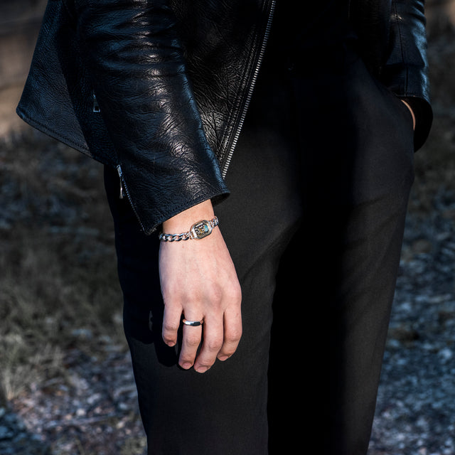 silver band ring on a finger