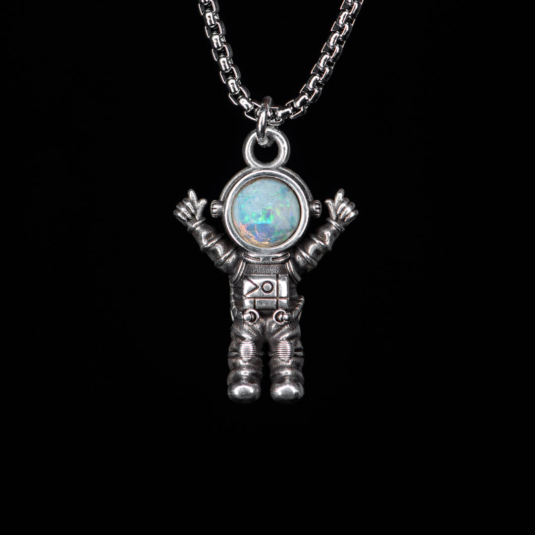 Silver astronaut pendant