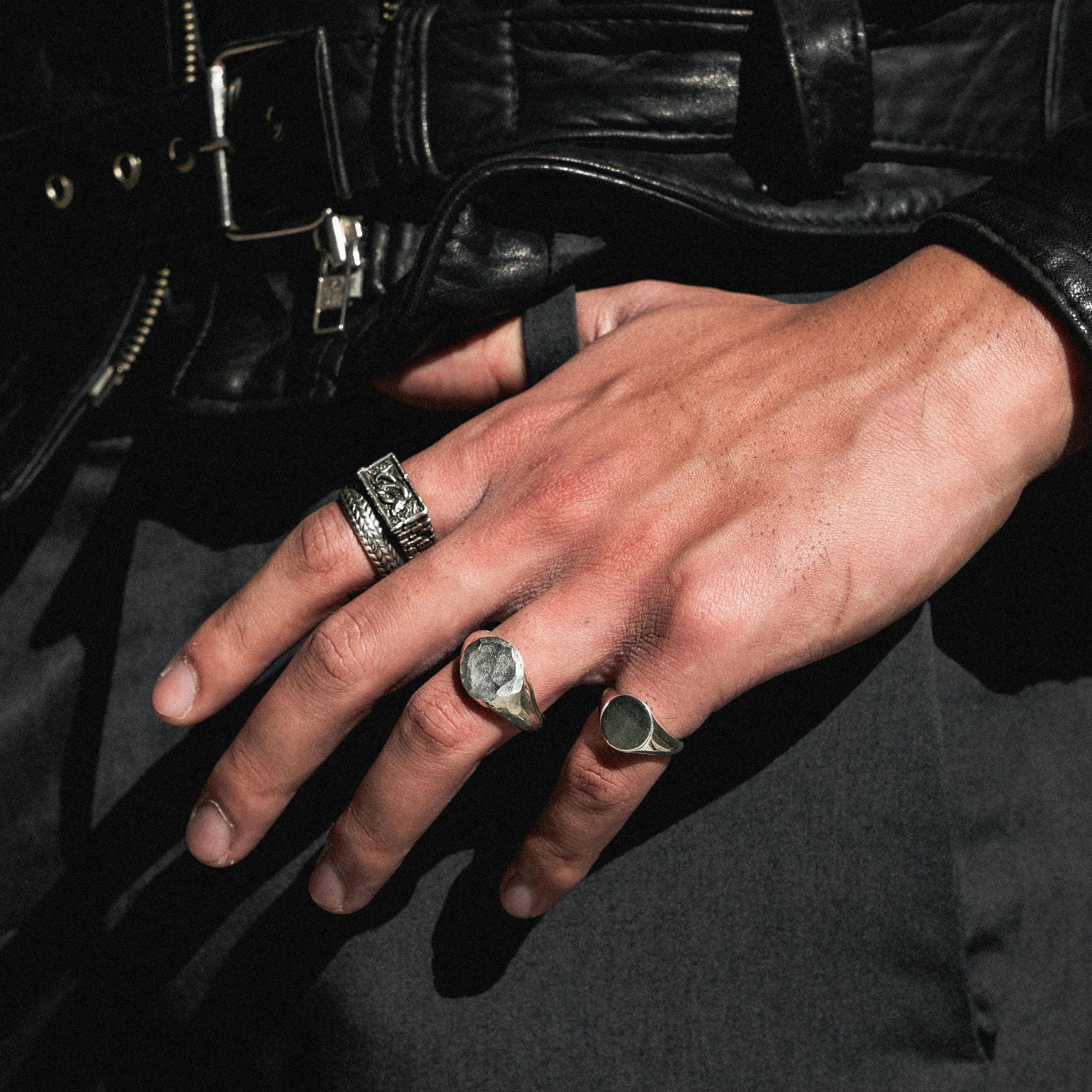 pinky signet ring on finger