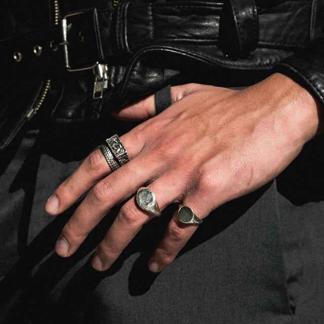 pinky signet ring on finger